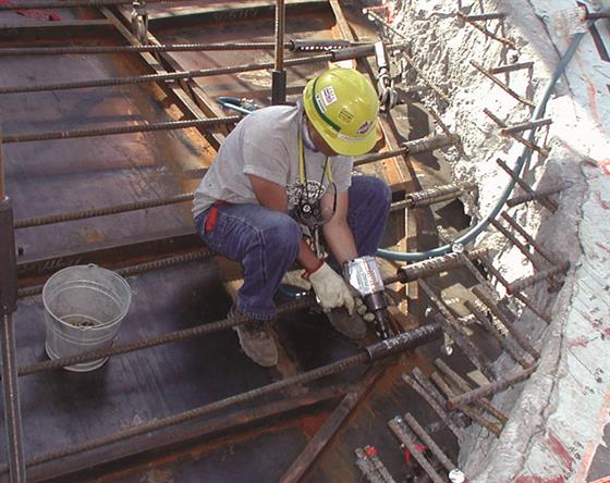 Contractor installing a Dayton Superior Bar Lock mechanical rebar coupler